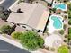Beautiful home showcasing a serene pool, landscaping, and a charming patio area at 2472 E Prescott Pl, Chandler, AZ 85249