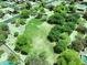 Lush green park and play area surrounded by mature trees within the neighborhood at 2472 E Prescott Pl, Chandler, AZ 85249