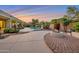 Expansive backyard featuring a pool, lush landscaping, fire pit and comfortable seating areas at 2472 E Prescott Pl, Chandler, AZ 85249