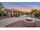 Outdoor oasis featuring a fire pit, covered patio, and swimming pool, perfect for entertaining and relaxation at 2472 E Prescott Pl, Chandler, AZ 85249