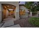 Inviting front exterior featuring a covered entryway, decorative shrubs, and neutral color scheme at 2472 E Prescott Pl, Chandler, AZ 85249