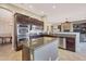 Well-appointed kitchen with an island, stainless steel appliances, granite countertops, and an open layout design at 2472 E Prescott Pl, Chandler, AZ 85249