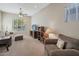 Inviting living room with a ceiling fan and a large window at 2472 E Prescott Pl, Chandler, AZ 85249