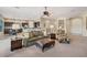 Open-concept living area showcasing seamless integration with the dining and kitchen spaces with plush furniture at 2472 E Prescott Pl, Chandler, AZ 85249