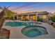 Stunning backyard pool and hot tub with a covered patio, perfect for outdoor relaxation and entertainment at 2472 E Prescott Pl, Chandler, AZ 85249