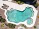 Aerial view of a sparkling pool with a built-in spa and sun loungers at 2472 E Prescott Pl, Chandler, AZ 85249