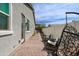 Cozy backyard offers a tranquil retreat with comfortable seating, a brick patio, and privacy fencing at 2513 E Pleasant Ln, Phoenix, AZ 85042