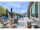 Backyard with pool, lounge area, dining area with patio umbrellas, and vibrant outdoor rug at 2513 E Pleasant Ln, Phoenix, AZ 85042