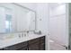 Bright bathroom vanity with a framed mirror and a view into the separate shower and toilet room at 2513 E Pleasant Ln, Phoenix, AZ 85042