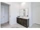 Bathroom vanity with dark wood cabinets, white countertop, and brushed nickel faucet at 2513 E Pleasant Ln, Phoenix, AZ 85042