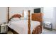 Bedroom with a four-poster bed, end tables, dresser, and large television at 2513 E Pleasant Ln, Phoenix, AZ 85042