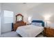 Comfortable bedroom featuring a ceiling fan, dresser, and large windows at 2513 E Pleasant Ln, Phoenix, AZ 85042
