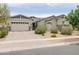 Charming single-story home with a three-car garage, desert landscaping, and a warm, inviting curb appeal at 2513 E Pleasant Ln, Phoenix, AZ 85042