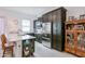 Stylish kitchen boasts dark cabinetry, stainless steel appliances, and a breakfast bar for casual dining at 2513 E Pleasant Ln, Phoenix, AZ 85042