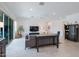Bright and airy living room with modern furnishings, neutral palette, and large sliding doors offering ample natural light at 2513 E Pleasant Ln, Phoenix, AZ 85042