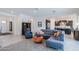 Open concept living area featuring stylish furniture, neutral tones, and seamless flow into the modern kitchen at 2513 E Pleasant Ln, Phoenix, AZ 85042