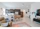 Open-concept living room seamlessly connects to the kitchen, creating a spacious and inviting atmosphere at 2513 E Pleasant Ln, Phoenix, AZ 85042