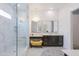 A bright main bathroom features a large glass-enclosed shower and dual sink vanity at 2513 E Pleasant Ln, Phoenix, AZ 85042