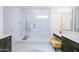 The stunning main bathroom features a walk-in shower with marble tile and dual sink vanity at 2513 E Pleasant Ln, Phoenix, AZ 85042