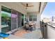 Covered patio with a ceiling fan, outdoor seating, and a colorful rug is perfect for outdoor entertaining at 2513 E Pleasant Ln, Phoenix, AZ 85042