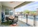 The covered patio overlooks the pool and is the perfect place to enjoy outdoor dining and relaxing at 2513 E Pleasant Ln, Phoenix, AZ 85042