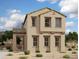 Charming two-story home featuring a tan stucco exterior, tiled roof, and well-manicured landscaping at 26205 N 19Th Ln, Phoenix, AZ 85085
