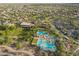 Aerial view of the Foothills Center showcasing the pool, picnic area, playground, and recreational facilities amidst lush landscaping at 29491 N 122Nd Gln, Peoria, AZ 85383