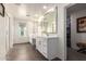 Spacious bathroom with double sinks, framed mirror and walk in closet at 29491 N 122Nd Gln, Peoria, AZ 85383