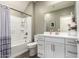 Bright bathroom with a white vanity, a framed mirror, and a shower-tub combination at 29491 N 122Nd Gln, Peoria, AZ 85383