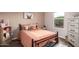 Cozy bedroom featuring a comfortable bed, a window, and soft, inviting decor at 29491 N 122Nd Gln, Peoria, AZ 85383