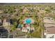Aerial view of the sparkling community pool area with a splash pad, perfect for Gathering fun and relaxation in the sun at 29491 N 122Nd Gln, Peoria, AZ 85383