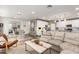 Open concept living space featuring a modern kitchen, dining area, and comfortable seating at 29491 N 122Nd Gln, Peoria, AZ 85383