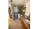 Bathroom featuring double sinks, a shower, and convenient laundry area at 3144 N 84Th Pl, Scottsdale, AZ 85251