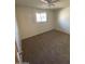 Bedroom with ceiling fan, window and neutral colored carpet at 3144 N 84Th Pl, Scottsdale, AZ 85251