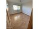 Bedroom featuring a ceiling fan, wood floors and natural light from the window at 3144 N 84Th Pl, Scottsdale, AZ 85251