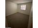 Bedroom showcasing a window with shutters and neutral carpet at 3144 N 84Th Pl, Scottsdale, AZ 85251
