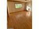 Bright bedroom with hardwood floors and a window providing natural light at 3144 N 84Th Pl, Scottsdale, AZ 85251