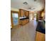 Spacious kitchen featuring wood cabinetry, dark countertops, and a tiled floor at 3144 N 84Th Pl, Scottsdale, AZ 85251