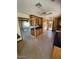 Open kitchen featuring tile floors, wood cabinets, and stainless steel appliances at 3144 N 84Th Pl, Scottsdale, AZ 85251