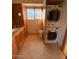 Bathroom laundry area with stacked washer and dryer, next to bathroom counter at 3144 N 84Th Pl, Scottsdale, AZ 85251