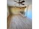 Bright living room with hardwood floors and multiple ceiling fans at 3144 N 84Th Pl, Scottsdale, AZ 85251