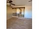 Living room with wood flooring and a peek into the kitchen area at 3144 N 84Th Pl, Scottsdale, AZ 85251