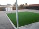 Backyard with artificial grass, gravel area, and a storage shed at 329 N 83Rd Pl, Mesa, AZ 85207