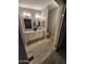 En-suite bathroom featuring dual sinks and updated lighting at 329 N 83Rd Pl, Mesa, AZ 85207