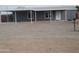 Charming single-story home with a covered carport featuring a low maintenance gravel yard at 329 N 83Rd Pl, Mesa, AZ 85207
