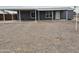 Single-story home with a covered carport, gravel front yard, and a tidy, well-maintained exterior at 329 N 83Rd Pl, Mesa, AZ 85207