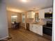 Bright eat-in kitchen boasting updated appliances and white cabinetry at 329 N 83Rd Pl, Mesa, AZ 85207
