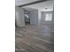 Open-concept living room with durable floors and neutral color scheme at 329 N 83Rd Pl, Mesa, AZ 85207