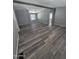 Living room with durable floors, grey walls and an exposed beam at 329 N 83Rd Pl, Mesa, AZ 85207