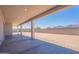 Covered patio leading to a spacious backyard with a block wall for privacy at 35234 N Barley St, San Tan Valley, AZ 85144